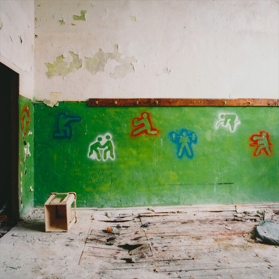 Gym wall stencil deco at Soviet Military Base FZ. Former DDR, Germany. October 2014.