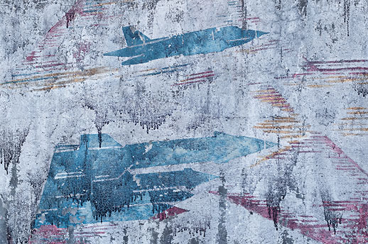 Mural close-up two at Soviet Military Base V. Former DDR, Germany. October 2011.